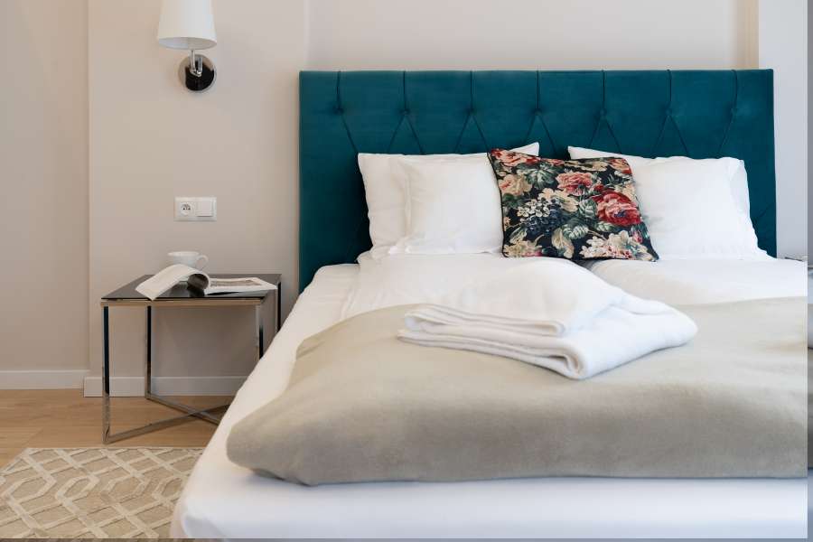 Łóżko w sypialni Altara Apartamenty